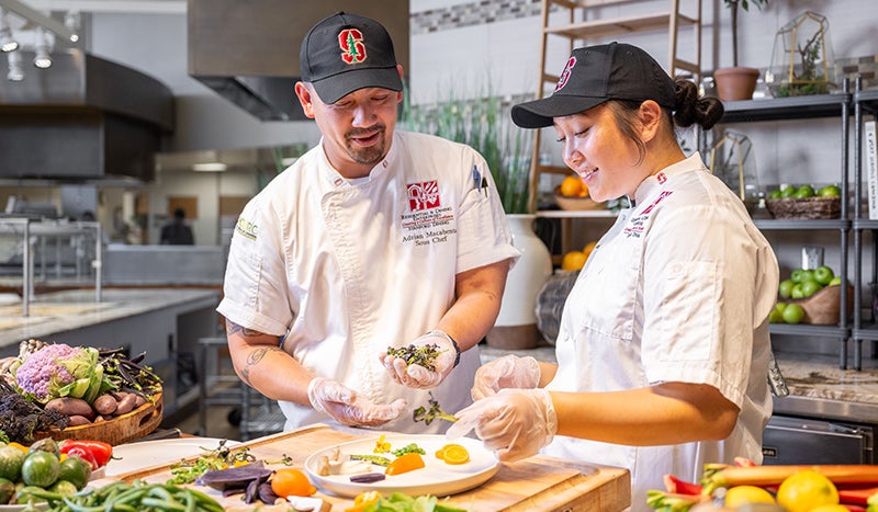 Residential & Dining Enterprises staff	preparing meals.